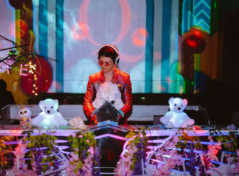 chillbill on a stage dressed with flowers and glowing polar bears